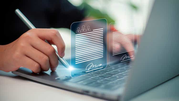 Signing business contract concept. Online business contract Electronic signature, e-signing, digital document management, paperless office, on a futuristic virtual interface screen.