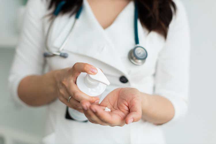the dermatologist touches the hands smears with cream, dry skin, skin disease. close up