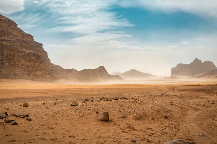 The wind raises the dust in desert