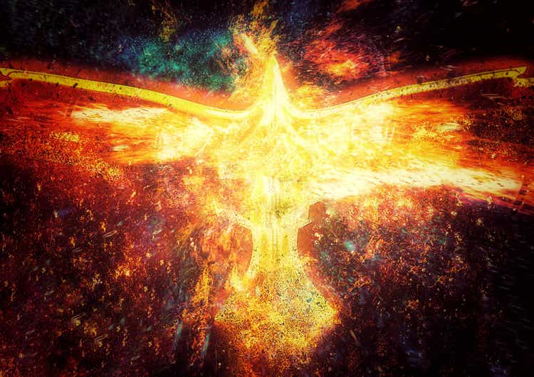 3D illustration of a firebird flapping its wings in the dark