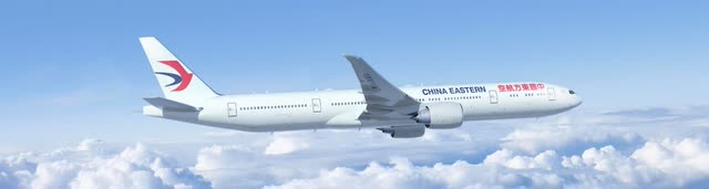 На этом изображении изображен Боинг 777-300ER в полете авиакомпании China Eastern Airlines.